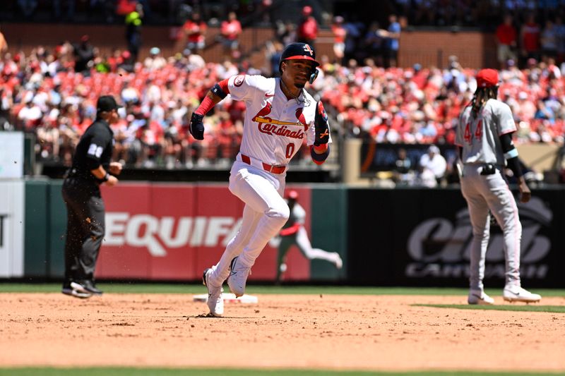 Jun 30, 2024; St. Louis, Missouri, USA; St. Louis Cardinals shortstop Masyn Winn (0) runs to third off a single from outfielder Alec Burleson (41) against the Cincinnati Reds during the fifth inning at Busch Stadium. Mandatory Credit: Jeff Le-USA TODAY Sports