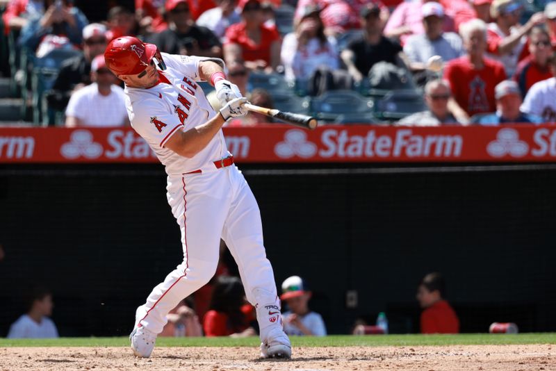 Apr 24, 2024; Anaheim, California, USA;  Los Angeles Angels designated hitter Mike Trout (27) hits a home run during the sixth inning against the Baltimore Orioles at Angel Stadium. Mandatory Credit: Kiyoshi Mio-USA TODAY Sports