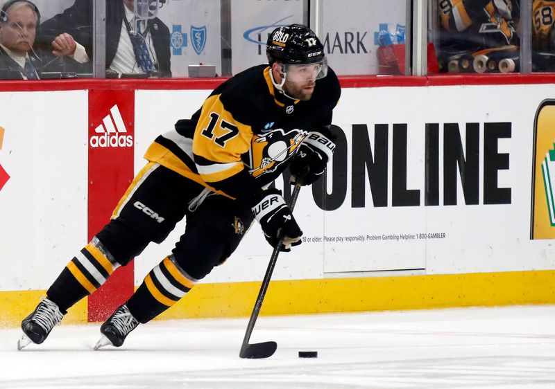 Apr 15, 2024; Pittsburgh, Pennsylvania, USA;  Pittsburgh Penguins right wing Bryan Rust (17) skates with the puck against the Nashville Predators during the second period at PPG Paints Arena. Mandatory Credit: Charles LeClaire-USA TODAY Sports