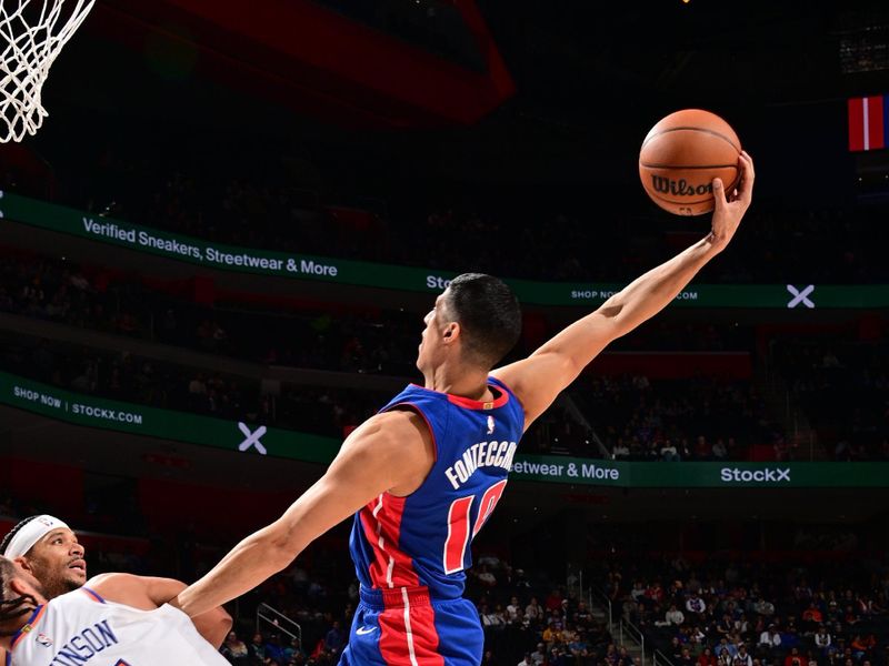 DETROIT, MI - NOVEMBER 1: Simone Fontecchio #19 of the Detroit Pistons rebounds the ball during the game against the New York Knicks on November 1, 2024 at Little Caesars Arena in Detroit, Michigan. NOTE TO USER: User expressly acknowledges and agrees that, by downloading and/or using this photograph, User is consenting to the terms and conditions of the Getty Images License Agreement. Mandatory Copyright Notice: Copyright 2024 NBAE (Photo by Chris Schwegler/NBAE via Getty Images)