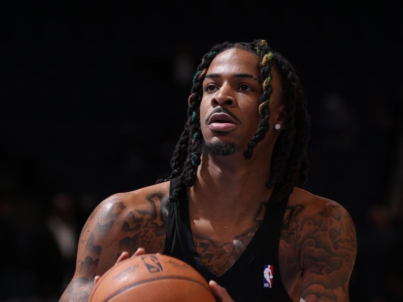 MEMPHIS, TN - DECEMBER 13:  Ja Morant #12 of the Memphis Grizzlies warms up before the game against the Brooklyn Nets on December 13, 2024 at FedExForum in Memphis, Tennessee. NOTE TO USER: User expressly acknowledges and agrees that, by downloading and or using this photograph, User is consenting to the terms and conditions of the Getty Images License Agreement. Mandatory Copyright Notice: Copyright 2024 NBAE (Photo by Joe Murphy/NBAE via Getty Images)