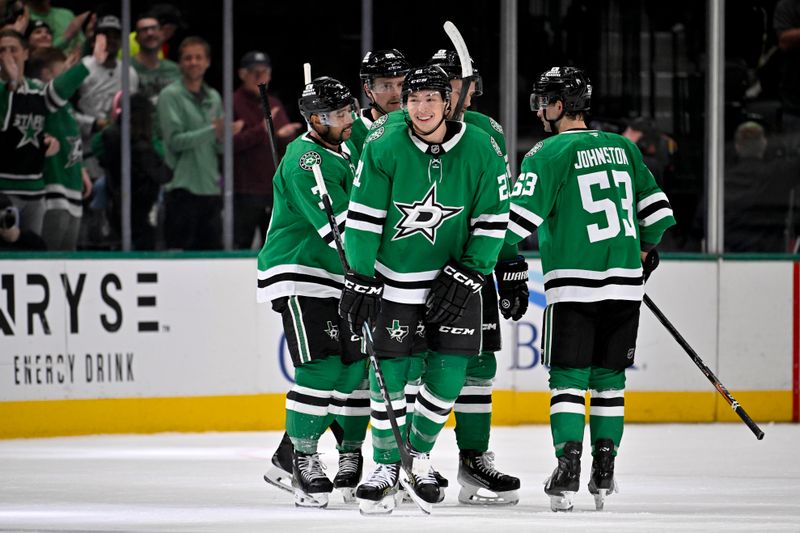 Nov 20, 2024; Dallas, Texas, USA; Dallas Stars defenseman Mathew Dumba (3) and center Wyatt Johnston (53) and left wing Jason Robertson (21) celebrates a goal scored by Robertson against the San Jose Sharks during the first period at the American Airlines Center. Mandatory Credit: Jerome Miron-Imagn Images