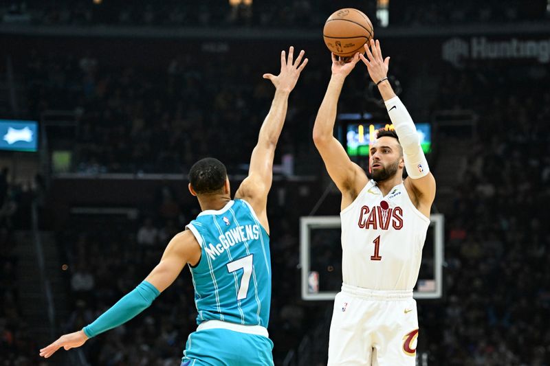 CLEVELAND, OHIO - APRIL 14: Max Strus #1 of the Cleveland Cavaliers shoots a three-point basket against Bryce McGowens #7 of the Charlotte Hornets during the first half at Rocket Mortgage Fieldhouse on April 14, 2024 in Cleveland, Ohio. NOTE TO USER: User expressly acknowledges and agrees that, by downloading and or using this photograph, User is consenting to the terms and conditions of the Getty Images License Agreement. (Photo by Nick Cammett/Getty Images)