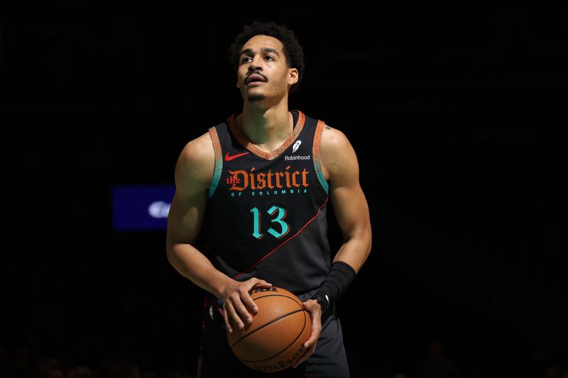 WASHINGTON, DC -? FEBRUARY 25: Jordan Poole #13 of the Washington Wizards shoots a free throw during the game against the Cleveland Cavaliers on February 25, 2024 at Capital One Arena in Washington, DC. NOTE TO USER: User expressly acknowledges and agrees that, by downloading and or using this Photograph, user is consenting to the terms and conditions of the Getty Images License Agreement. Mandatory Copyright Notice: Copyright 2024 NBAE (Photo by Stephen Gosling/NBAE via Getty Images)