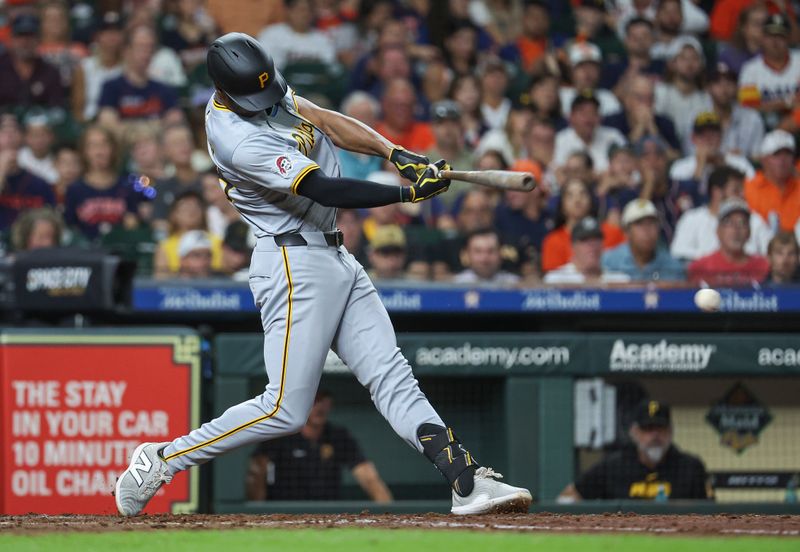 Jul 29, 2024; Houston, Texas, USA; Pittsburgh Pirates center fielder Michael A. Taylor (18) hits a single during the sixth inning against the Houston Astros at Minute Maid Park. Mandatory Credit: Troy Taormina-USA TODAY Sports