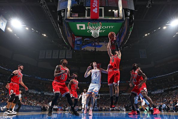 OKLAHOMA CITY, OK - NOVEMBER 22:  Nikola Vucevic #9 of the Chicago Bulls grabs a rebound during the game against the Oklahoma City Thunder on November 22, 2023 at Paycom Arena in Oklahoma City, Oklahoma. NOTE TO USER: User expressly acknowledges and agrees that, by downloading and or using this photograph, User is consenting to the terms and conditions of the Getty Images License Agreement. Mandatory Copyright Notice: Copyright 2023 NBAE (Photo by Zach Beeker/NBAE via Getty Images)