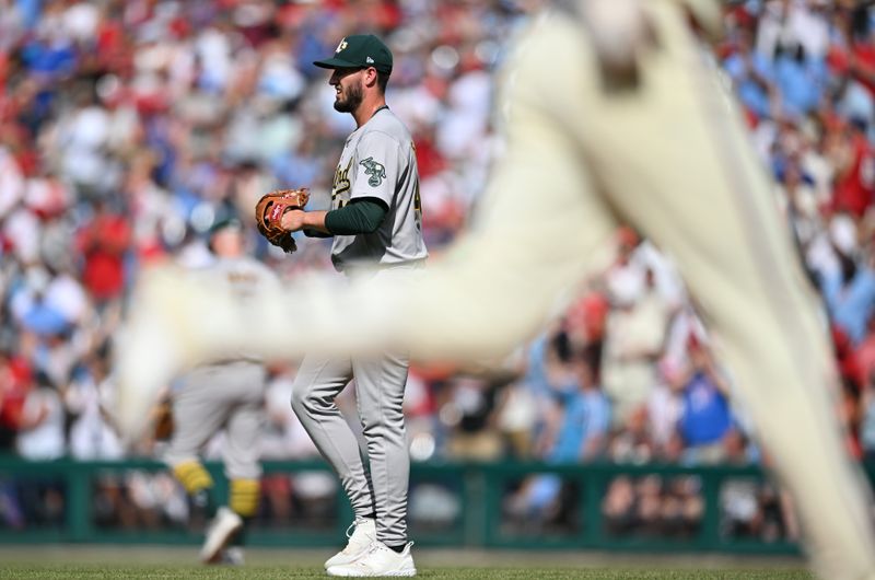 Jul 13, 2024; Philadelphia, Pennsylvania, USA; Oakland Athletics starting pitcher Mitch Spence (40) looks on as Philadelphia Phillies outfielder Nick Castellanos (8) rounds the bases after hitting a two-run home run in the second inning at Citizens Bank Park. Mandatory Credit: Kyle Ross-USA TODAY Sports