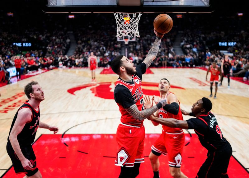 TORONTO, ON - JANUARY 31: Lonzo Ball #2 of the Chicago Bulls goes to the basket against the Toronto Raptors during the second half of their basketball game at the Scotiabank Arena on January 31, 2025 in Toronto, Ontario, Canada. NOTE TO USER: User expressly acknowledges and agrees that, by downloading and/or using this Photograph, user is consenting to the terms and conditions of the Getty Images License Agreement. (Photo by Mark Blinch/Getty Images)