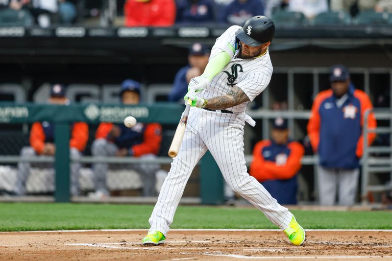 May 13, 2023; Chicago, Illinois, USA; Chicago White Sox third baseman Yoan Moncada (10) doubles against the Houston Astros during the second inning at Guaranteed Rate Field. Mandatory Credit: Kamil Krzaczynski-USA TODAY Sports