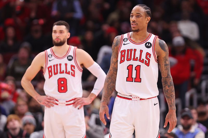 CHICAGO, ILLINOIS - FEBRUARY 13: Zach LaVine #8 and DeMar DeRozan #11 of the Chicago Bulls look on against the Orlando Magic during the second half at United Center on February 13, 2023 in Chicago, Illinois. NOTE TO USER: User expressly acknowledges and agrees that, by downloading and or using this photograph, User is consenting to the terms and conditions of the Getty Images License Agreement.  (Photo by Michael Reaves/Getty Images)