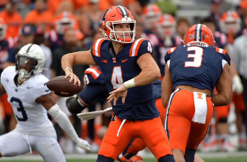 Sep 16, 2023; Champaign, Illinois, USA;  Illinois Fighting Illini quarterback John Paddock (4) passes the ball against the Penn State Nittany Lions during the second half at Memorial Stadium. Mandatory Credit: Ron Johnson-USA TODAY Sports