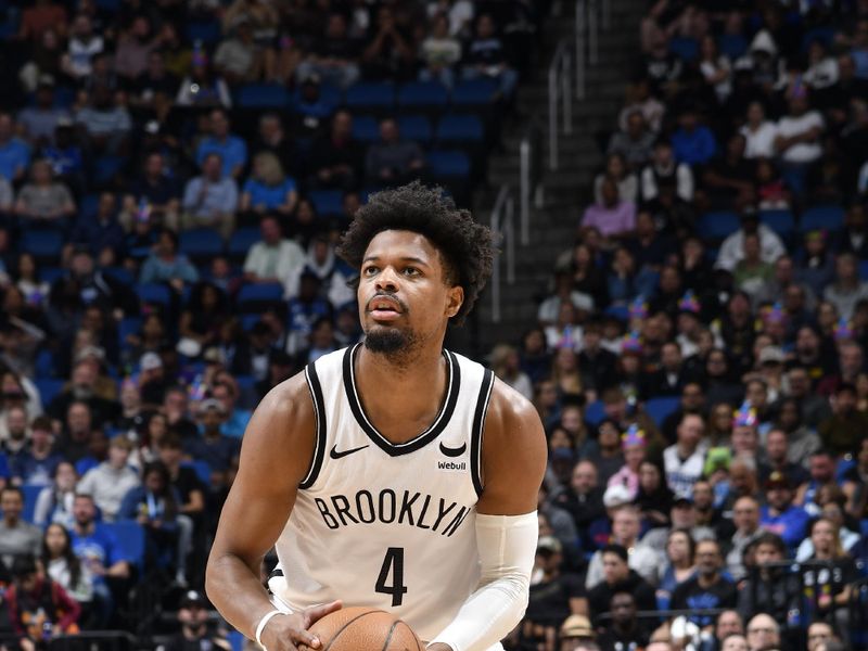 ORLANDO, FL - FEBRUARY 27: Dennis Smith Jr. #4 of the Brooklyn Nets handles the ball during the game against the Orlando Magic on February 27, 2024 at the Kia Center in Orlando, Florida. NOTE TO USER: User expressly acknowledges and agrees that, by downloading and or using this photograph, User is consenting to the terms and conditions of the Getty Images License Agreement. Mandatory Copyright Notice: Copyright 2024 NBAE (Photo by Fernando Medina/NBAE via Getty Images)