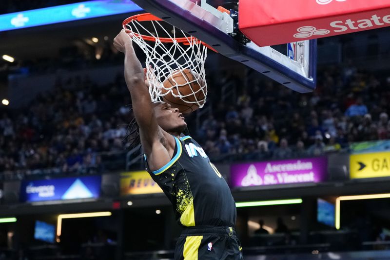 INDIANAPOLIS, INDIANA - JANUARY 28: Bennedict Mathurin #00 of the Indiana Pacers dunks the ball in the first quarter against the Memphis Grizzlies at Gainbridge Fieldhouse on January 28, 2024 in Indianapolis, Indiana. NOTE TO USER: User expressly acknowledges and agrees that, by downloading and or using this photograph, User is consenting to the terms and conditions of the Getty Images License Agreement. (Photo by Dylan Buell/Getty Images)