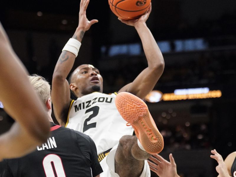 Jan 6, 2024; Columbia, Missouri, USA; Missouri Tigers guard Tamar Bates (2) shoots as he draws a foul from Georgia Bulldogs guard Blue Cain (0) during the first half at Mizzou Arena. Mandatory Credit: Denny Medley-USA TODAY Sports