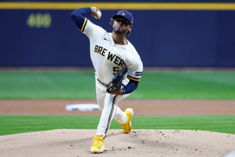 Oct 4, 2023; Milwaukee, Wisconsin, USA; Milwaukee Brewers starting pitcher Freddy Peralta (51) pitches in the first inning against the Arizona Diamondbacks during game two of the Wildcard series for the 2023 MLB playoffs at American Family Field. Mandatory Credit: Kamil Krzaczynski-USA TODAY Sports