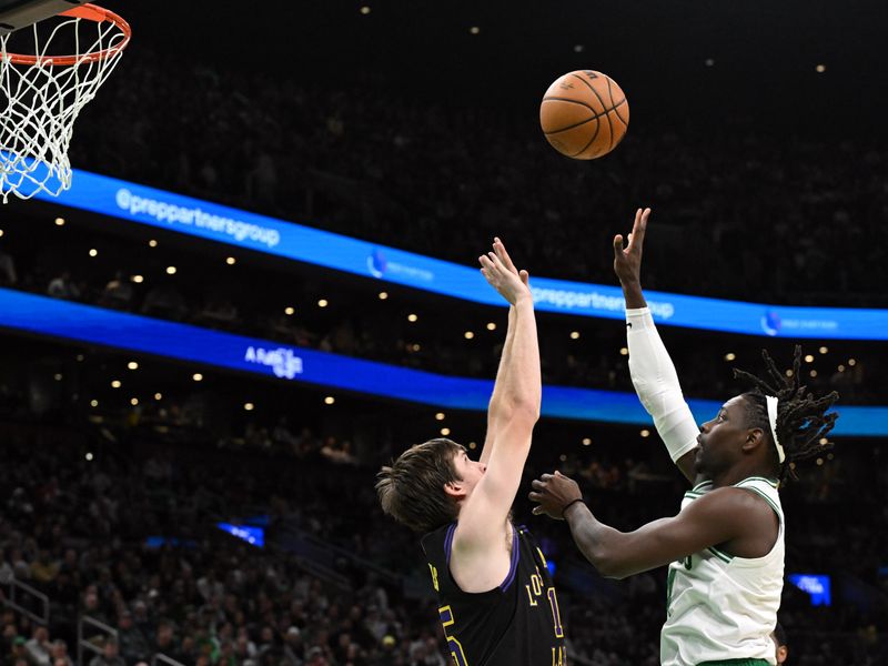 BOSTON, MASSACHUSETTS - FEBRUARY 01: Jrue Holiday #4 of the Boston Celtics attempts a basket against Austin Reaves #15 of the Los Angeles Lakers during the fourth quarter at the TD Garden on February 01, 2024 in Boston, Massachusetts. NOTE TO USER: User expressly acknowledges and agrees that, by downloading and or using this photograph, User is consenting to the terms and conditions of the Getty Images License Agreement. (Photo by Brian Fluharty/Getty Images)