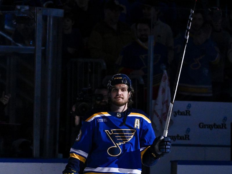 Feb 15, 2024; St. Louis, Missouri, USA;  St. Louis Blues center Robert Thomas (18) salutes the fans after he was named first star of the game in a victory over the Edmonton Oilers at Enterprise Center. Mandatory Credit: Jeff Curry-USA TODAY Sports