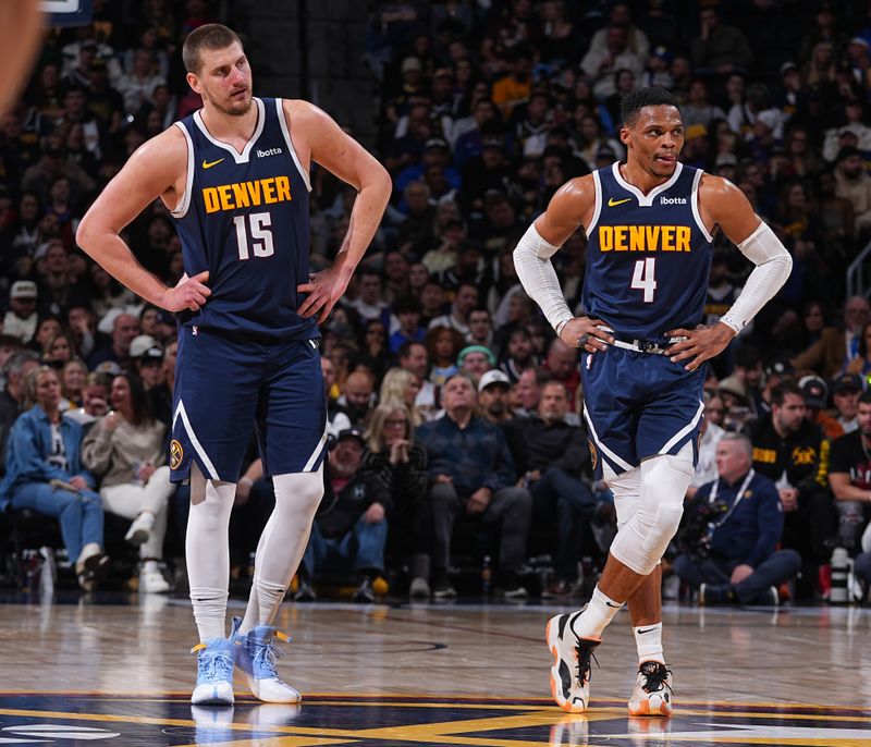 DENVER, CO - JANUARY 10:  Nikola Jokic #15 and Russell Westbrook #4 of the Denver Nuggets look on during the game against the Brooklyn Nets on January 10, 2025 at Ball Arena in Denver, Colorado. NOTE TO USER: User expressly acknowledges and agrees that, by downloading and/or using this Photograph, user is consenting to the terms and conditions of the Getty Images License Agreement. Mandatory Copyright Notice: Copyright 2025 NBAE (Photo by Bart Young/NBAE via Getty Images)