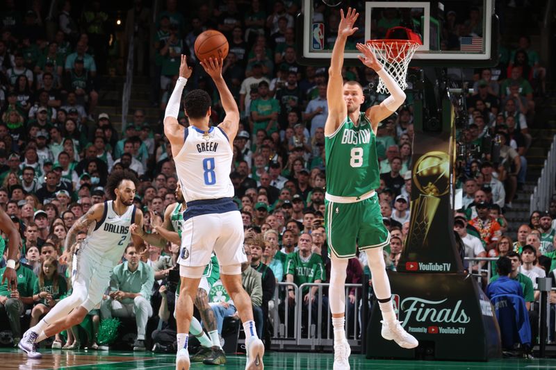 BOSTON, MA - JUNE 17: Josh Green #8 of the Dallas Mavericks shoots a three point basket during the game  against the Boston Celtics during Game 5 of the 2024 NBA Finals on June 17, 2024 at the TD Garden in Boston, Massachusetts. NOTE TO USER: User expressly acknowledges and agrees that, by downloading and or using this photograph, User is consenting to the terms and conditions of the Getty Images License Agreement. Mandatory Copyright Notice: Copyright 2024 NBAE  (Photo by Nathaniel S. Butler/NBAE via Getty Images)