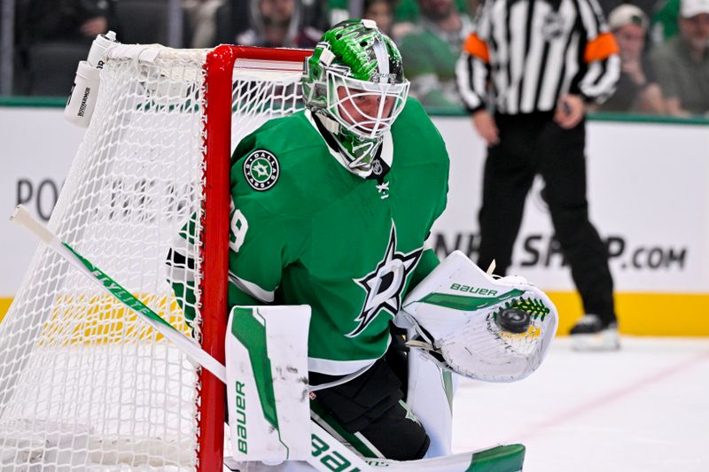 Oct 21, 2025; Dallas, Texas, USA; Dallas Stars goaltender Jake Oettinger (29) makes a glove save on a Columbus Blue Jackets shot during the first period at the American Airlines Center. Mandatory Credit: Jerome Miron-Imagn Images