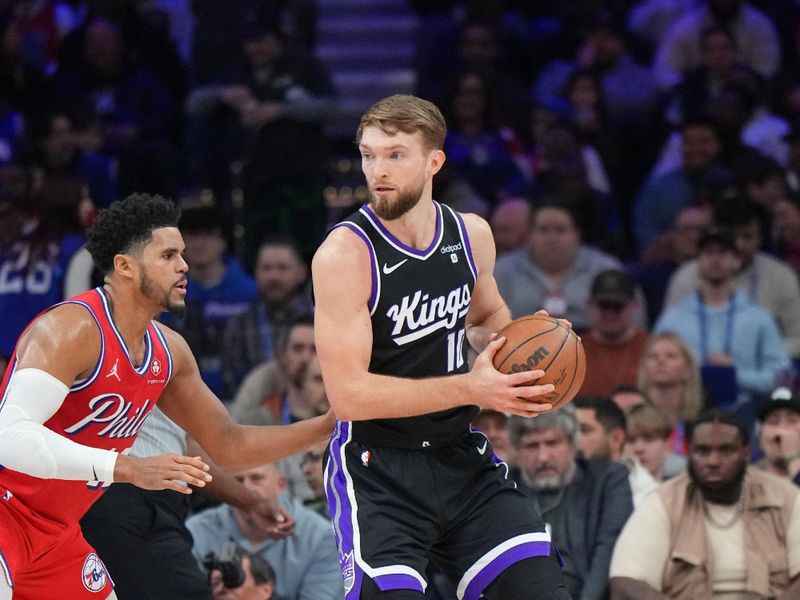 PHILADELPHIA, PA - JANUARY 12:  Domantas Sabonis #10 of the Sacramento Kings handles the ball during the game  on January 12, 2024 at the Wells Fargo Center in Philadelphia, Pennsylvania NOTE TO USER: User expressly acknowledges and agrees that, by downloading and/or using this Photograph, user is consenting to the terms and conditions of the Getty Images License Agreement. Mandatory Copyright Notice: Copyright 2024 NBAE (Photo by Jesse D. Garrabrant/NBAE via Getty Images)