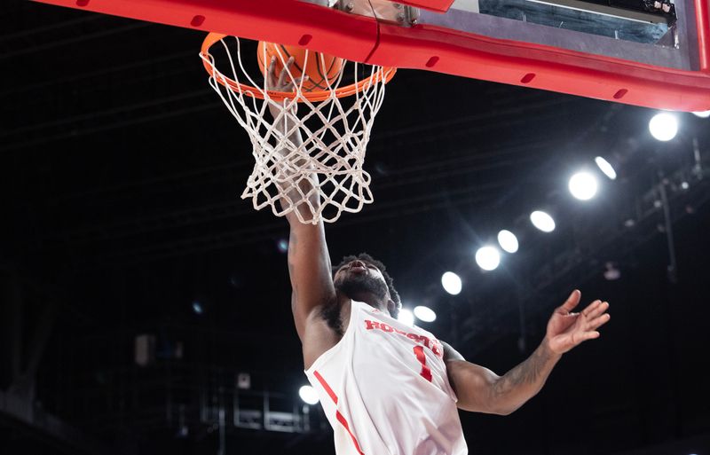 Jan 6, 2024; Houston, Texas, USA; Houston Cougars guard Jamal Shead (1) scores against West Virginia Mountaineers guard Kerr Kriisa (not pictured) in the second half at Fertitta Center. Mandatory Credit: Thomas Shea-USA TODAY Sports