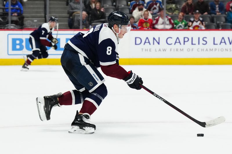 Mar 4, 2024; Denver, Colorado, USA; Colorado Avalanche defenseman Cale Makar (8) controls the puck in the third period against the Chicago Blackhawks at Ball Arena. Mandatory Credit: Ron Chenoy-USA TODAY Sports