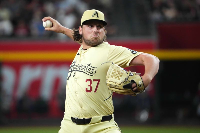 Aug 13, 2024; Phoenix, Arizona, USA; Arizona Diamondbacks pitcher Kevin Ginkel (37) pitches against the Colorado Rockies during the seventh inning at Chase Field. Mandatory Credit: Joe Camporeale-USA TODAY Sports