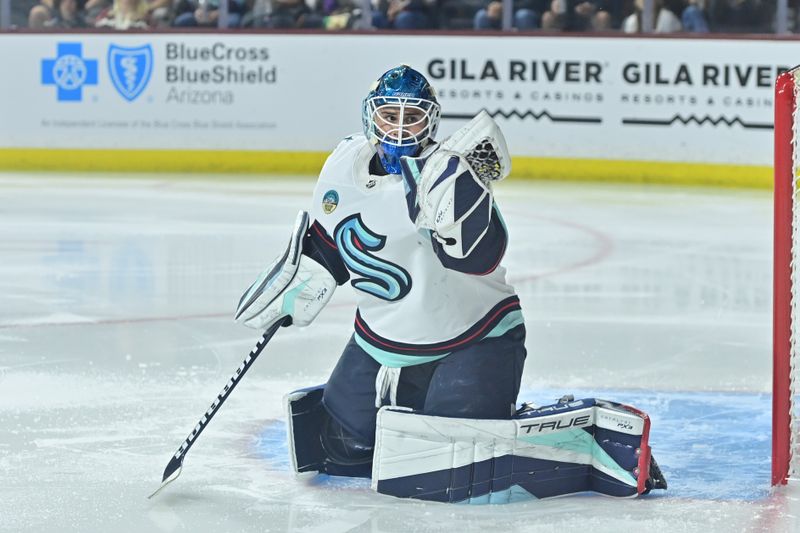 Nov 7, 2023; Tempe, Arizona, USA; Seattle Kraken goaltender Joey Daccord (35) makes a glove save in the second period against the Arizona Coyotes at Mullett Arena. Mandatory Credit: Matt Kartozian-USA TODAY Sports