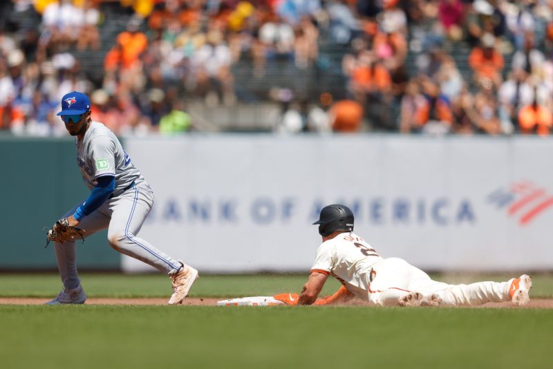 Jul 11, 2024; San Francisco, California, USA; San Francisco Giants third base Matt Chapman (26) steals second base during the sixth inning against the Toronto Blue Jays at Oracle Park. Mandatory Credit: Sergio Estrada-USA TODAY Sports