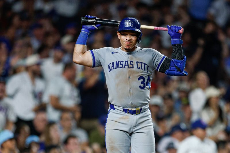 Jul 22, 2025; Chicago, Illinois, USA; Kansas City Royals catcher Freddy Fermin (34) reacts after striking out against the Chicago Cubs during the seventh inning at Wrigley Field. Mandatory Credit: Kamil Krzaczynski-Imagn Images