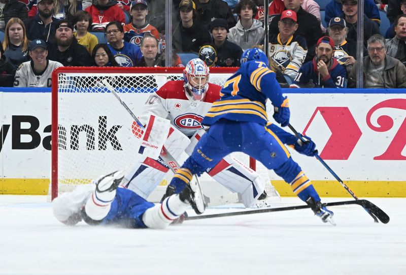 Nov 11, 2024; Buffalo, New York, USA; Montreal Canadiens goaltender Cayden Primeau (30) looks to block a shot by Buffalo Sabres right wing JJ Peterka (77) in the third period  at KeyBank Center. Mandatory Credit: Mark Konezny-Imagn Images