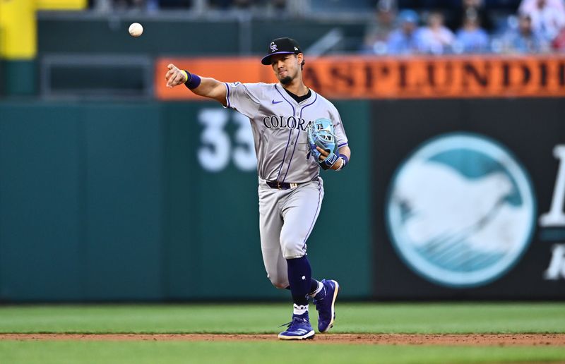 Apr 16, 2024; Philadelphia, Pennsylvania, USA; Colorado Rockies shortstop Ezequiel Tovar (14) throws to first against the Philadelphia Phillies in the second inning at Citizens Bank Park. Mandatory Credit: Kyle Ross-USA TODAY Sports