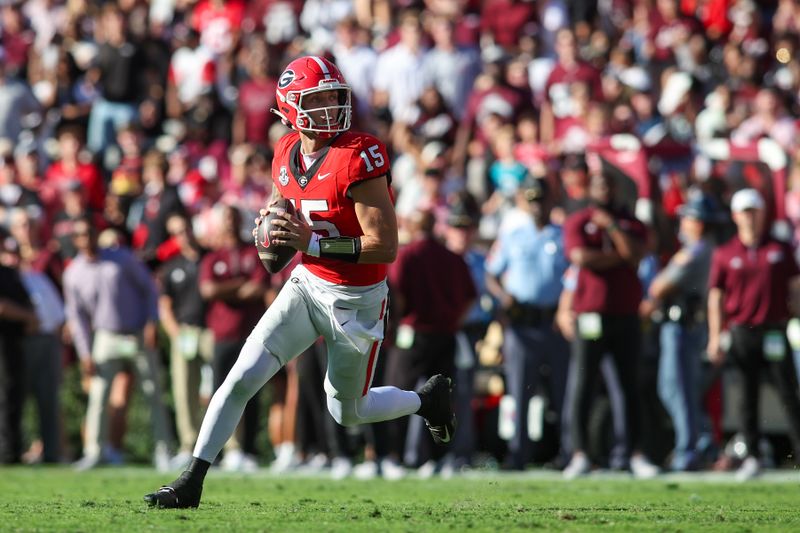 Oct 12, 2024; Athens, Georgia, USA; Georgia Bulldogs quarterback Carson Beck (15) rolls out to pass against the Mississippi State Bulldogs in the first quarter at Sanford Stadium. Mandatory Credit: Brett Davis-Imagn Images

