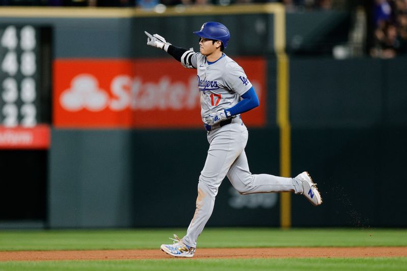 Sep 27, 2024; Denver, Colorado, USA; Los Angeles Dodgers designated hitter Shohei Ohtani (17) gestures as he rounds the bases on a three run home run in the sixth inning against the Colorado Rockies at Coors Field. Mandatory Credit: Isaiah J. Downing-Imagn Images