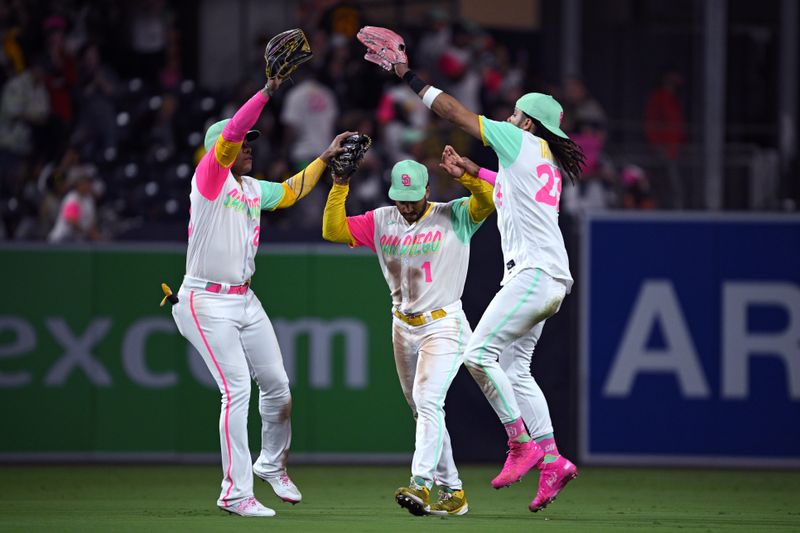 Jun 23, 2023; San Diego, California, USA; San Diego Padres right fielder Fernando Tatis Jr. (23) celebrates with  center fielder Trent Grisham (1) and left fielder Juan Soto (22) after defeating the Washington Nationals at Petco Park. Mandatory Credit: Orlando Ramirez-USA TODAY Sports