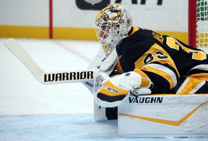 Nov 2, 2024; Pittsburgh, Pennsylvania, USA;  Pittsburgh Penguins goaltender Alex Nedeljkovic (39) stretches during a time-out against the Pittsburgh Penguins in the second period at PPG Paints Arena. Mandatory Credit: Charles LeClaire-Imagn Images