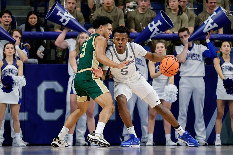 Mar 9, 2024; Colorado Springs, Colorado, USA; Air Force Falcons guard Ethan Taylor (5) controls the ball as Colorado State Rams guard Josiah Strong (3) guards in the first half at Clune Arena. Mandatory Credit: Isaiah J. Downing-USA TODAY Sports