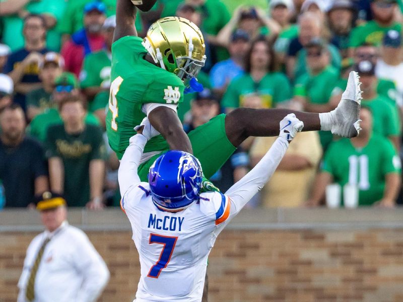 Oct 4, 2025; South Bend, Indiana, USA; Boise State Broncos defensive back A'Marion McCoy (7) blocks Notre Dame Fighting Irish linebacker Jaiden Ausberry (4) from leaping over him during the second half at Notre Dame Stadium. Mandatory Credit: Michael Caterina-Imagn Images