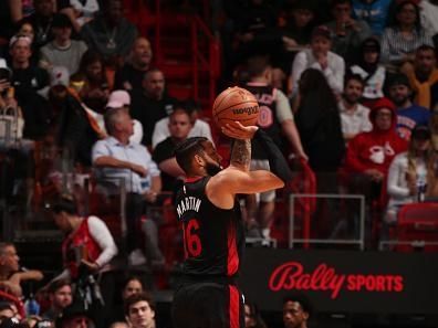 MIAMI, FL - DECEMBER 16: Caleb Martin #16 of the Miami Heat shoots a three point basket during the game against the Chicago Bulls on December 16, 2023 at Kaseya Center in Miami, Florida. NOTE TO USER: User expressly acknowledges and agrees that, by downloading and or using this Photograph, user is consenting to the terms and conditions of the Getty Images License Agreement. Mandatory Copyright Notice: Copyright 2023 NBAE (Photo by Issac Baldizon/NBAE via Getty Images)