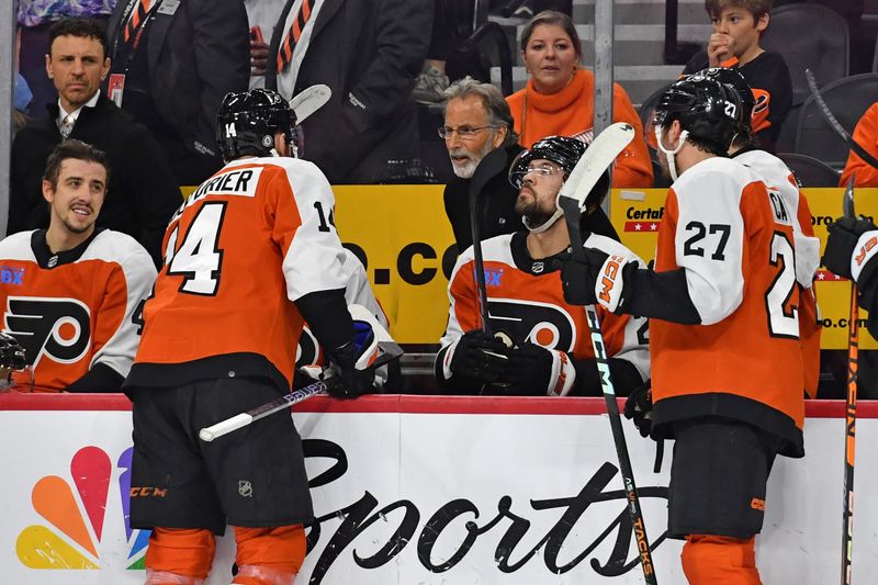 Apr 16, 2024; Philadelphia, Pennsylvania, USA; Philadelphia Flyers head coach John Tortorella talks with  center Sean Couturier (14) against the Washington Capitals during the first period at Wells Fargo Center. Mandatory Credit: Eric Hartline-USA TODAY Sports