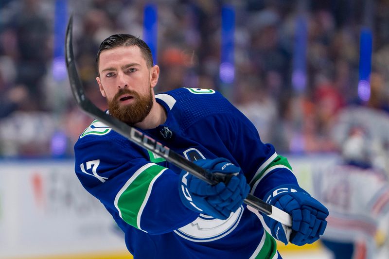 May 10, 2024; Vancouver, British Columbia, CAN; Vancouver Canucks defenseman Filip Hronek (17) shoots in warm up prior to game two of the second round of the 2024 Stanley Cup Playoffs against the Edmonton Oilers at Rogers Arena. Mandatory Credit: Bob Frid-USA TODAY Sports
