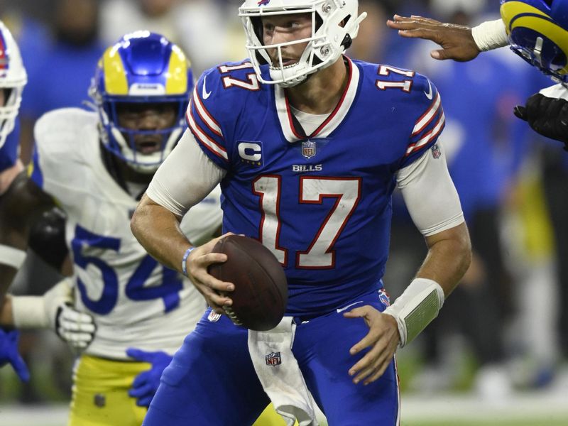 Buffalo Bills quarterback Josh Allen (17) avoids Los Angeles Rams defenders during an NFL football game Thursday, Sept. 8, 2021, in Inglewood, Calif. (AP Photo/John McCoy)