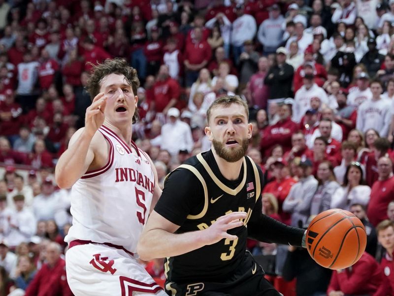Jan 27, 2026; Bloomington, Indiana, USA; Purdue Boilermakers guard Braden Smith (3) dribbles the ball past Indiana Hoosiers guard Conor Enright (5) during the first half at Simon Skjodt Assembly Hall. Mandatory Credit: Robert Goddin-Imagn Images