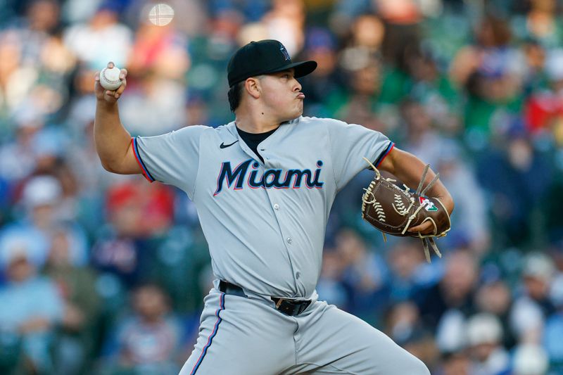 May 13, 2025; Chicago, Illinois, USA; Miami Marlins starting pitcher Valente Bellozo (83) delivers a pitch against the Chicago Cubs during the first inning at Wrigley Field. Mandatory Credit: Kamil Krzaczynski-Imagn Images