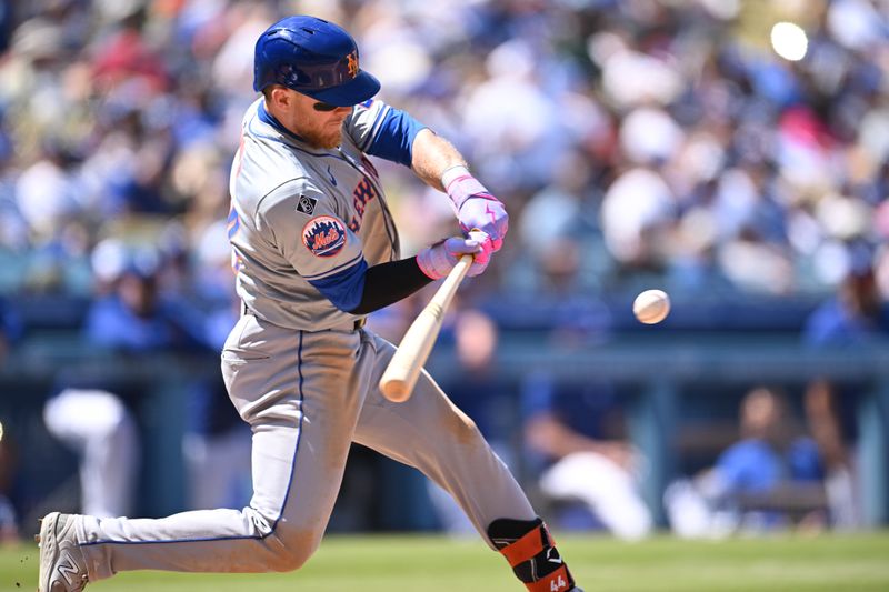 Apr 21, 2024; Los Angeles, California, USA; New York Mets outfielder Harrison Bader (44) singles against the Los Angeles Dodgers during the sixth inning at Dodger Stadium. Mandatory Credit: Jonathan Hui-USA TODAY Sports