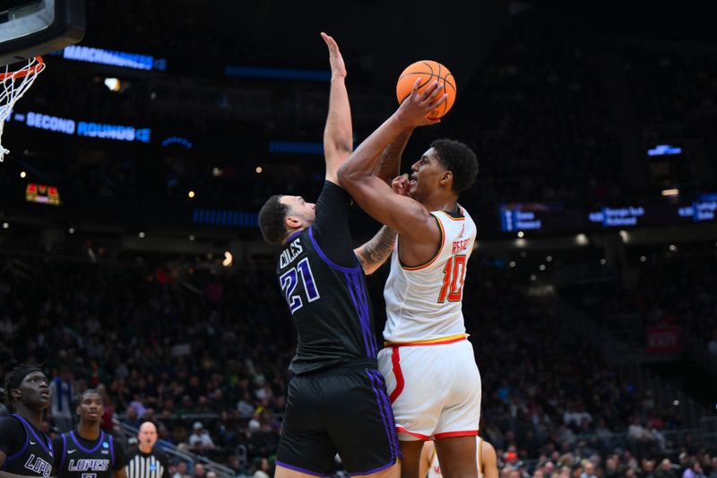 Mar 21, 2025; Seattle, WA, USA; Maryland Terrapins forward Julian Reese (10) shoots the ball against Grand Canyon Antelopes forward JaKobe Coles (21) during the first half at Climate Pledge Arena. Mandatory Credit: Steven Bisig-Imagn Images