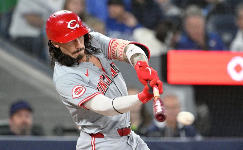 Aug 21, 2024; Toronto, Ontario, CAN;  Cincinnati Reds second baseman Jonathan India (6) hits a single against the Toronto Blue Jays in the fifth inning at Rogers Centre. Mandatory Credit: Dan Hamilton-USA TODAY Sports