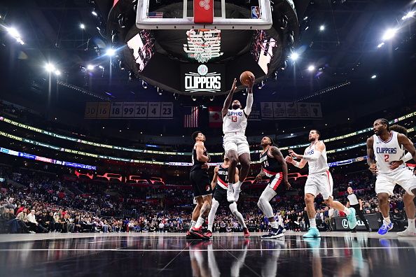 LOS ANGELES, CA - DECEMBER 11: Paul George #13 of the LA Clippers drives to the basket during the game against the Portland Trail Blazers on December 11, 2023 at Crypto.Com Arena in Los Angeles, California. NOTE TO USER: User expressly acknowledges and agrees that, by downloading and/or using this Photograph, user is consenting to the terms and conditions of the Getty Images License Agreement. Mandatory Copyright Notice: Copyright 2023 NBAE (Photo by Adam Pantozzi/NBAE via Getty Images)