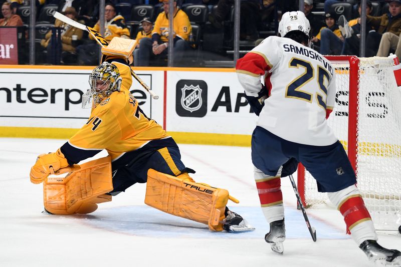 Jan 22, 2024; Nashville, Tennessee, USA; Nashville Predators goaltender Juuse Saros (74) defends against Florida Panthers right wing Mackie Samoskevich (25) as the puck bounces wide of the net during the second period at Bridgestone Arena. Mandatory Credit: Christopher Hanewinckel-USA TODAY Sports